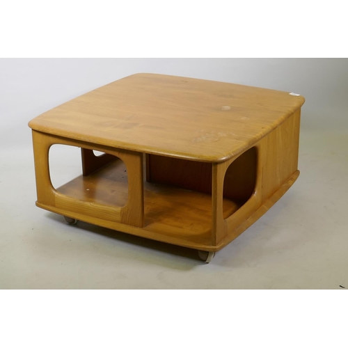 1024 - A mid C20th Ercol elm Pandora's box occasional table, Model 735, 80 x 80cm, 38cm high