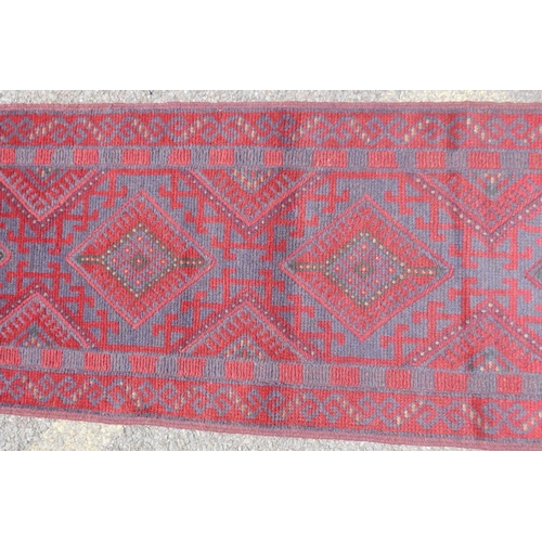 1031 - A red and blue ground hand woven Afghan Meshkin tribal runner, 60 x 240cm