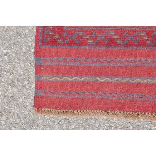 1031 - A red and blue ground hand woven Afghan Meshkin tribal runner, 60 x 240cm