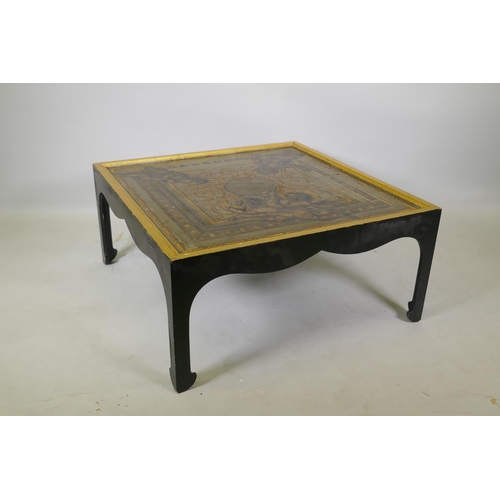 1037 - A low coffee table, the canvassed top with painted and parcel gilt decoration, 87 x 87 x 41cm