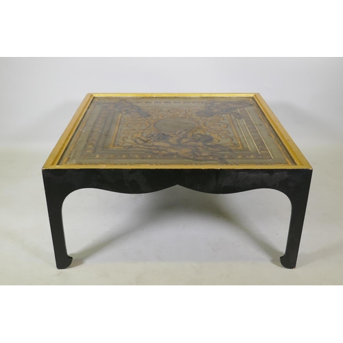 1037 - A low coffee table, the canvassed top with painted and parcel gilt decoration, 87 x 87 x 41cm