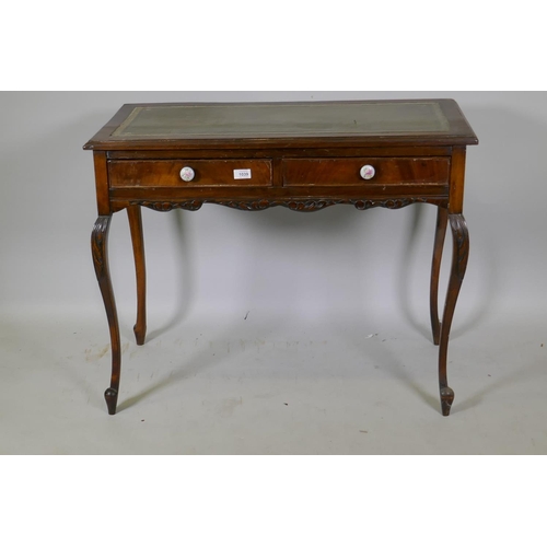 1039 - A Victorian mahogany two drawer writing table, with inset leather top, raised on cabriole supports, ... 