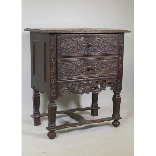 1042 - C19th Continental oak two drawer chest with carved front and pierced apron, raised on shaped support... 