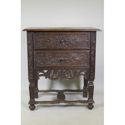 1042 - C19th Continental oak two drawer chest with carved front and pierced apron, raised on shaped support... 