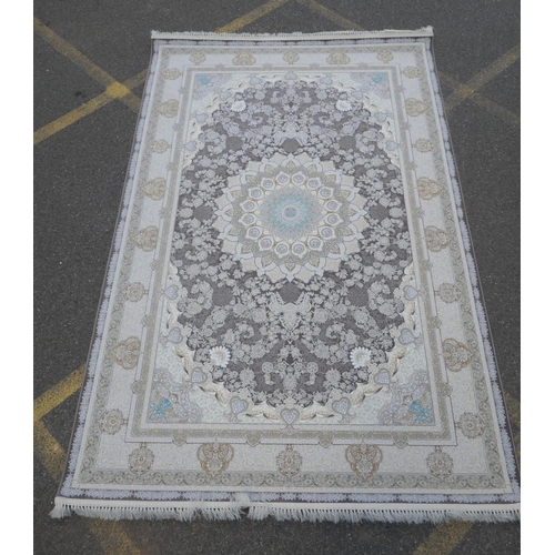 1045 - A fine woven white and pewter ground Iranian carpet embossed with a floral medallion design, 3 x 2m