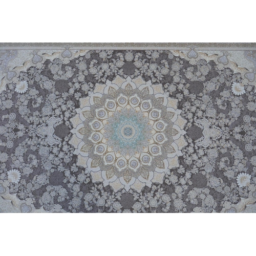 1045 - A fine woven white and pewter ground Iranian carpet embossed with a floral medallion design, 3 x 2m