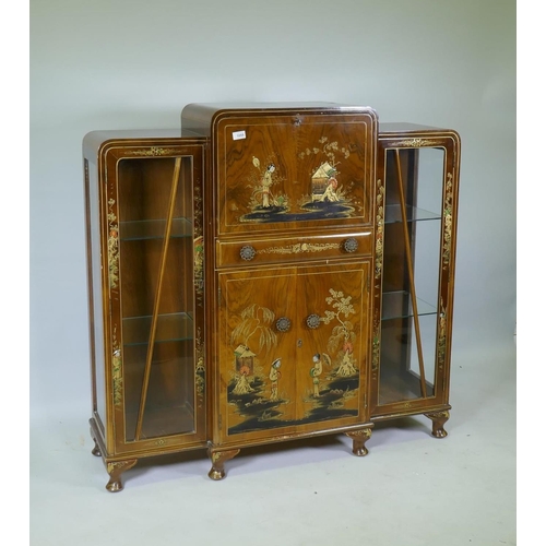 1055 - An Art Deco 'Turnidge' walnut Odeon style display cabinet with raised chinoiserie decoration, the fa... 