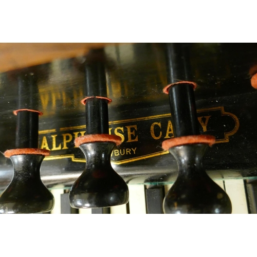 1056 - An Alphonse Cary of Newbury walnut cased organ, with carved and pierced fret decoration, 133 x 62 x ... 