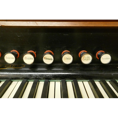 1056 - An Alphonse Cary of Newbury walnut cased organ, with carved and pierced fret decoration, 133 x 62 x ... 