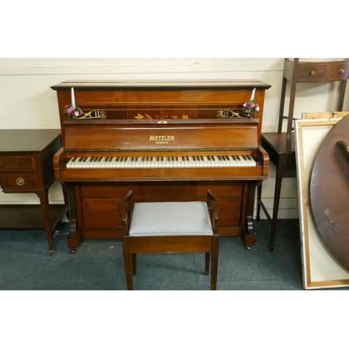 1057 - A Metzler of London walnut cased upright piano with inlaid decoration and brass candle sconces, and ... 