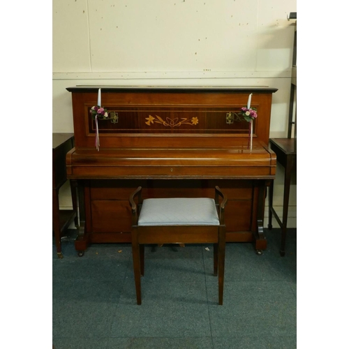 1057 - A Metzler of London walnut cased upright piano with inlaid decoration and brass candle sconces, and ... 