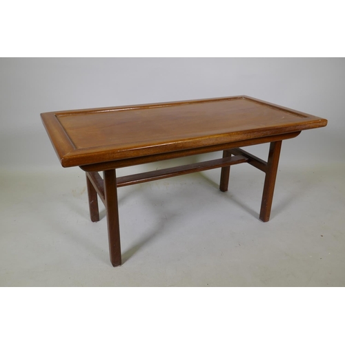 1059 - Oriental style hardwood coffee table with inset top raised on end supports united by a stretcher, 10... 