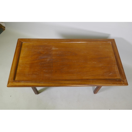 1059 - Oriental style hardwood coffee table with inset top raised on end supports united by a stretcher, 10... 