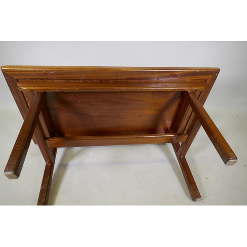 1059 - Oriental style hardwood coffee table with inset top raised on end supports united by a stretcher, 10... 