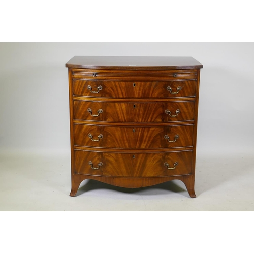 1073 - Georgian style mahogany bow front chest of drawers of small proportions, with reeded top and brushin... 