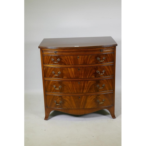 1073 - Georgian style mahogany bow front chest of drawers of small proportions, with reeded top and brushin... 