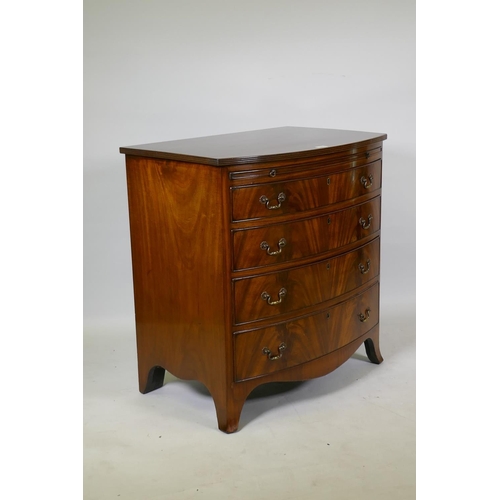 1073 - Georgian style mahogany bow front chest of drawers of small proportions, with reeded top and brushin... 