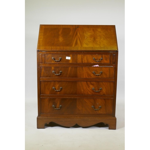 1076 - A Georgian style figured mahogany bureau, with fall front and fitted interior with inset leather fla... 