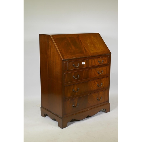 1076 - A Georgian style figured mahogany bureau, with fall front and fitted interior with inset leather fla... 