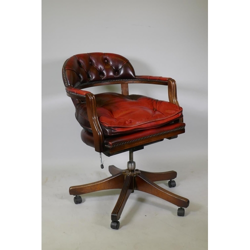 1077 - A button back leather tilt and swivel captains desk chair