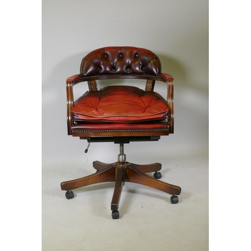 1077 - A button back leather tilt and swivel captains desk chair