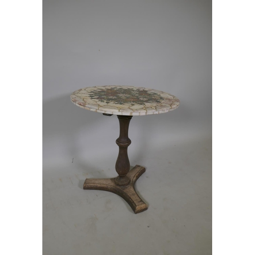 1078 - A marble mosaic topped coffee table decorated with a unique floral design, 51cm high, 50cm diameter