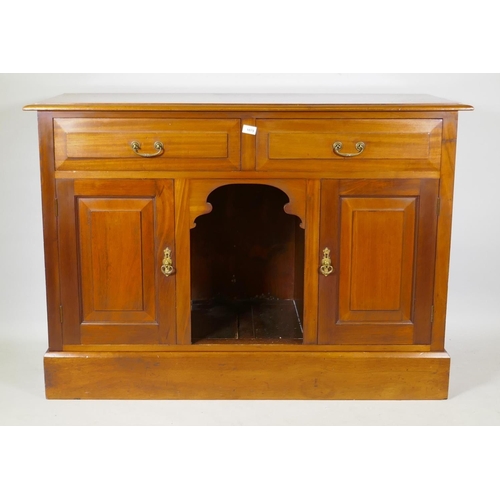 1079 - Victorian mahogany dresser with two drawers over dog kennel flanked by two cupboards, raised on a pl... 