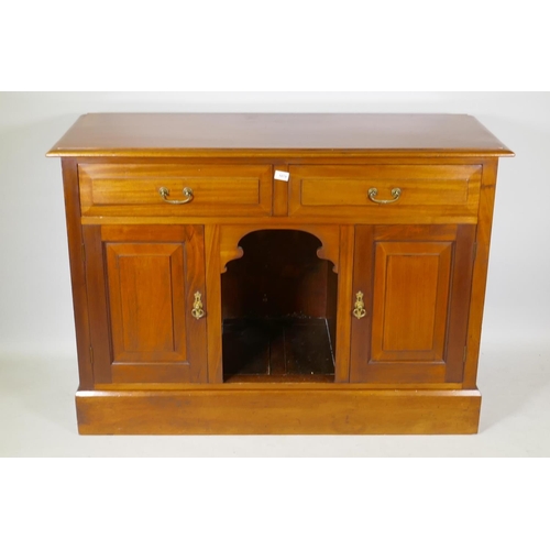 1079 - Victorian mahogany dresser with two drawers over dog kennel flanked by two cupboards, raised on a pl... 