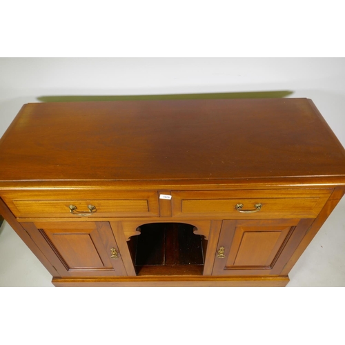 1079 - Victorian mahogany dresser with two drawers over dog kennel flanked by two cupboards, raised on a pl... 