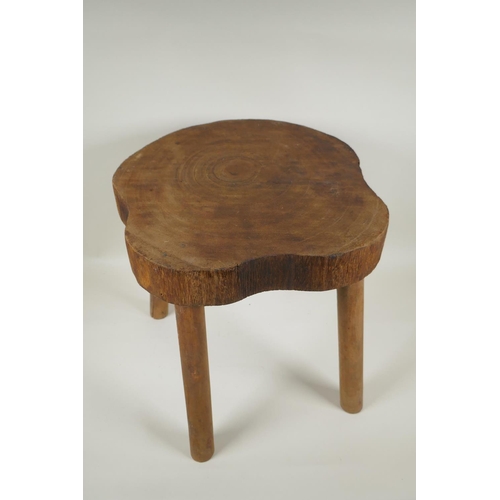 1088 - A rustic wooden stool, 37cm high