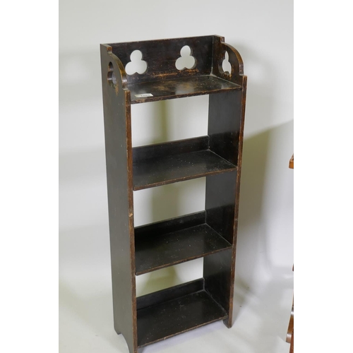 1089 - A small oak open bookcase with pierced trefoil decoration, 31 x 16 x 82cm, and a nest of three mahog... 