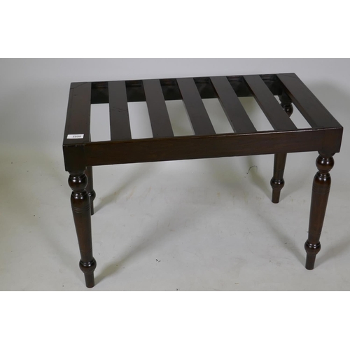 1090 - A stained beechwood luggage rack, raised on turned supports, 69 x 40 x 46cm