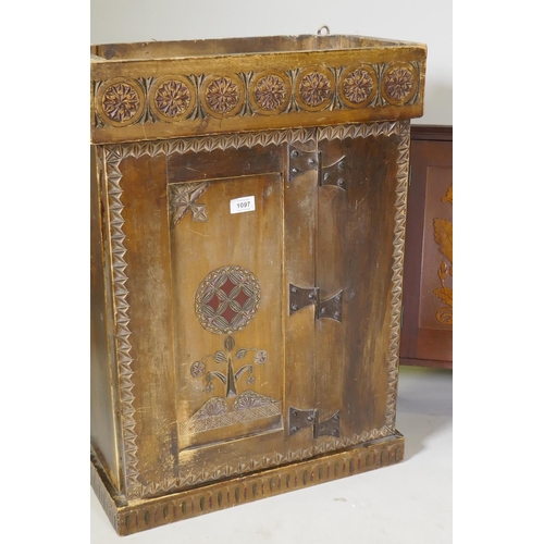 1097 - A C19th East European fruitwood hanging cupboard with carved and painted decoration, 52 x 24 x 71cm,... 