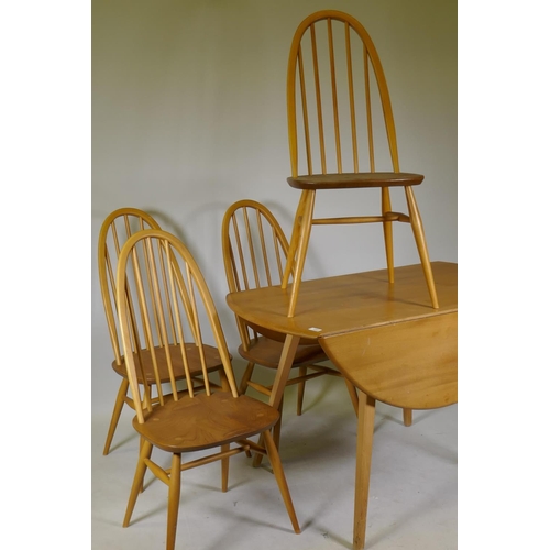 1099 - A mid C20th Ercol elm and beech dropleaf dining table, Model 384, and four Quaker chairs, Model 365,... 