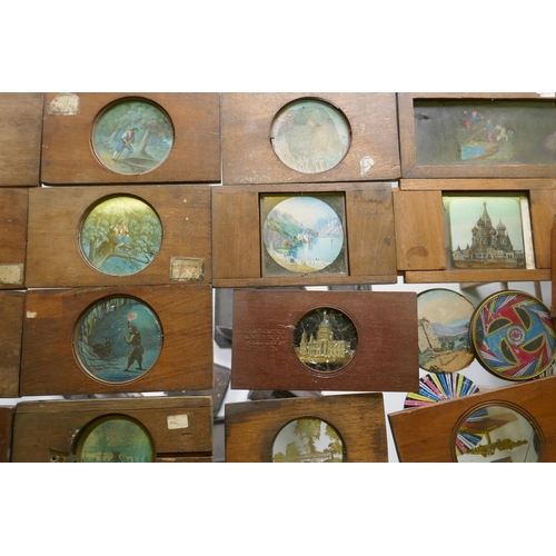 110 - Magic lantern slides, various in wood frames, kaleidoscope glasses and lantern reflectors, lights et... 