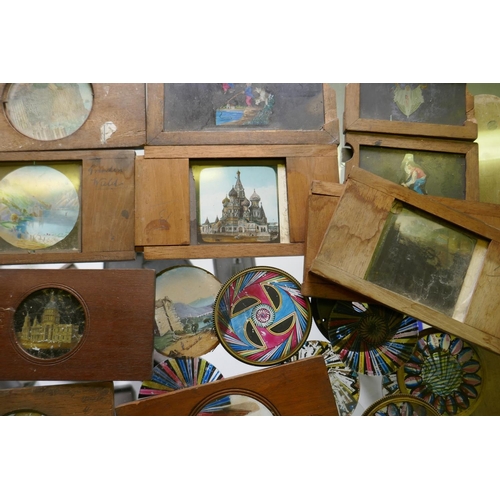 110 - Magic lantern slides, various in wood frames, kaleidoscope glasses and lantern reflectors, lights et... 