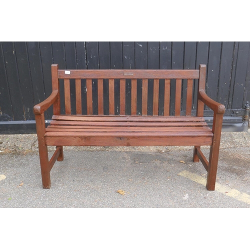 1103 - A teak garden bench, bears label Lister Wood Craft, From the teak of HMS Terrible whose guns relived... 