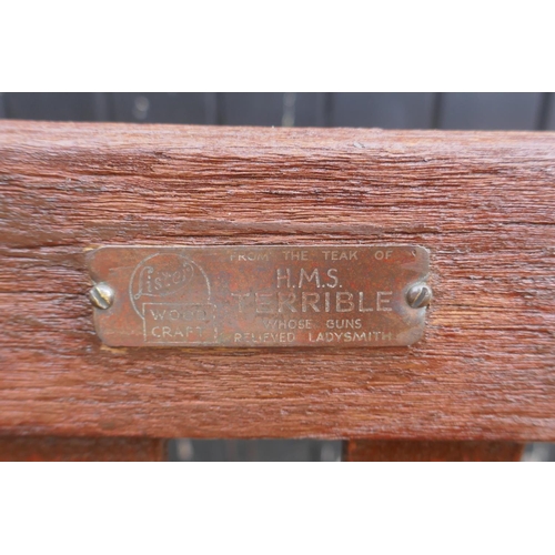 1103 - A teak garden bench, bears label Lister Wood Craft, From the teak of HMS Terrible whose guns relived... 