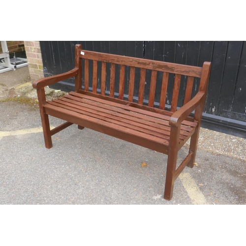 1104 - A vintage teak garden bench, 122cm wide