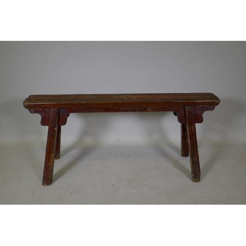 1105 - An antique Chinese elm topped bench, 105cm long