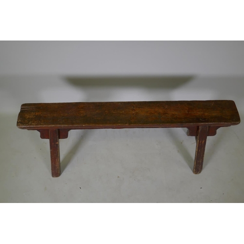 1105 - An antique Chinese elm topped bench, 105cm long