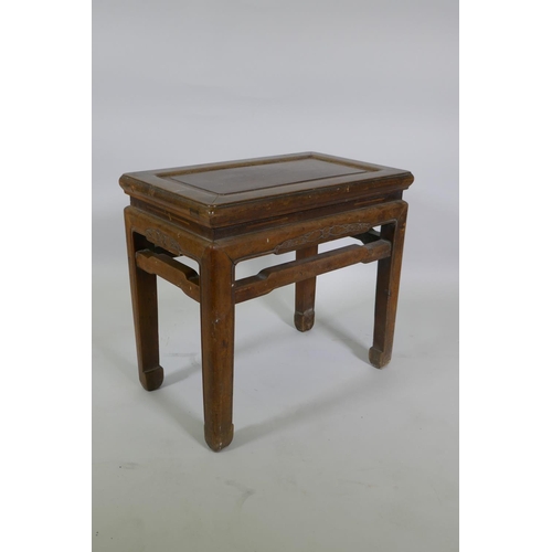 1110 - A Chinese hardwood rectangular occasional table with carved bat decoration, 54 x 33cm, 50cm high