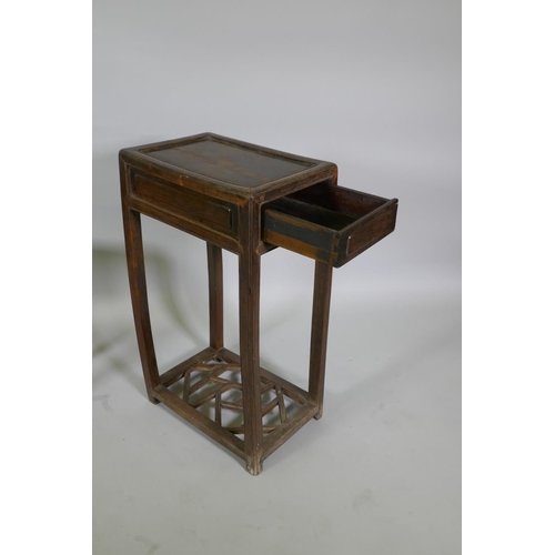 1113 - A Chinese hardwood occasional table with a single drawer and lattice undertier, together with a smal... 