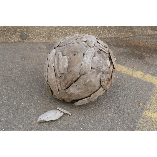 1117 - A driftwood ball garden sculpture, 44cm diameter