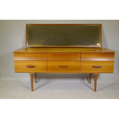 1118 - A mid century teak veneered six drawer dressing table labelled DS Furniture, 154 x 46cm, 66cm high, ... 