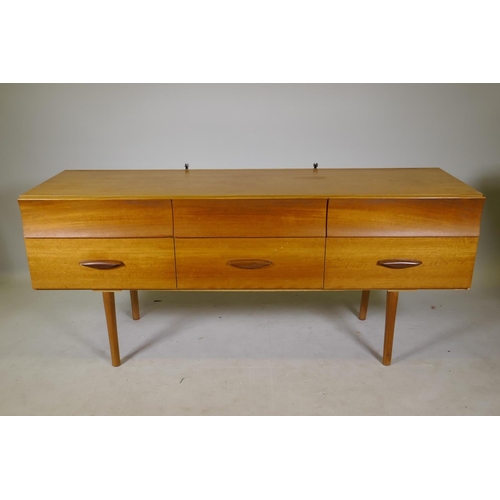 1118 - A mid century teak veneered six drawer dressing table labelled DS Furniture, 154 x 46cm, 66cm high, ... 