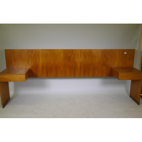 1119 - A mid century teak veneered bed-head with drawer to each side, 229cm, 147cm between the drawers, 91c... 