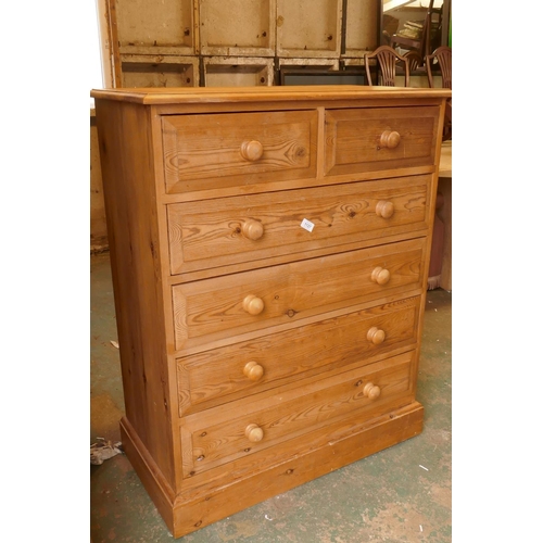 1127 - A pine chest of two over four drawers with moulded fronts, raised on a plinth base, 90 x 35 x 112cm