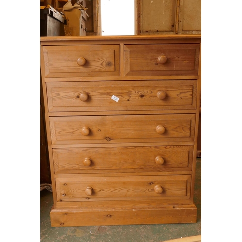 1127 - A pine chest of two over four drawers with moulded fronts, raised on a plinth base, 90 x 35 x 112cm