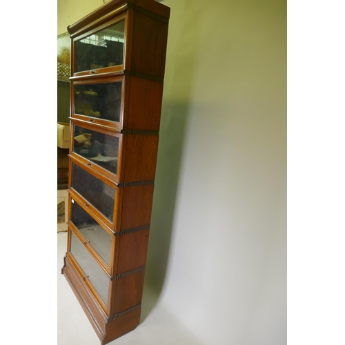 1129 - A Globe-Wernicke six section mahogany glazed bookcase, with base and top, 87 x 28 x 203cm